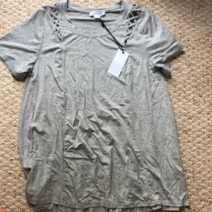 Grey short sleeve with design above sleeves